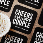 Cheers to the happy couple black rehearsal dinner square paper coaster<br><div class="desc">Before your wedding day, have some fun with a "Brews Before I Do's" celebration. Whether it's a rehearsal dinner, bachelor party or engagement party, this fun bold coaster design is perfect for a brewery or beer-themed celebration. This "cheers to the happy couple" original design can also be personalized with the...</div>