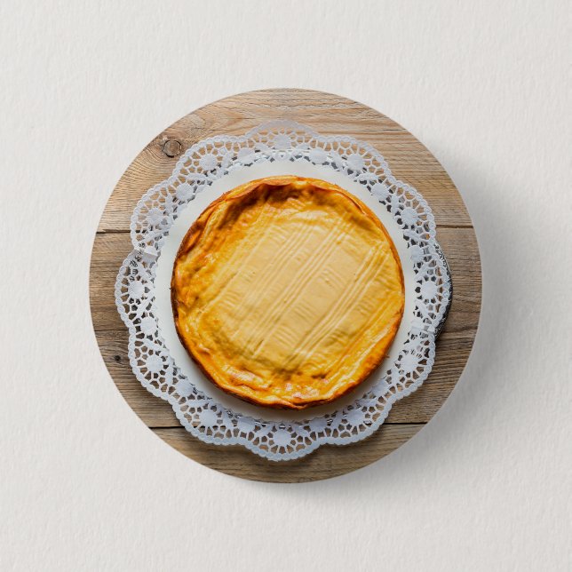 Cheesecake on rustic wood cake top. button (Front)
