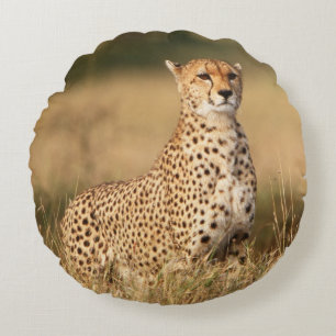 Cheetah on small mound for better visibility round pillow