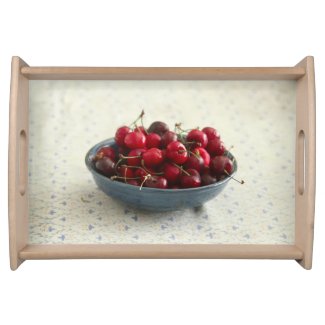 Cherries in a blue bowl  serving tray