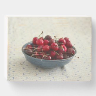 Cherries in a blue bowl  wooden box sign