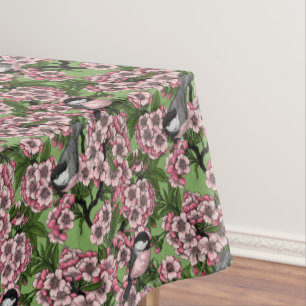 Cherry blossom and chickadees on green tablecloth