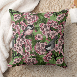 Cherry blossom and chickadees on green throw pillow