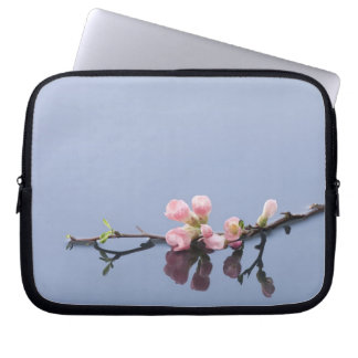 Cherry blossoms on water laptop sleeve