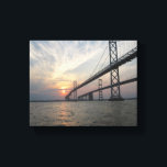 Chesapeake Bay Bridge Sunset canvas Print<br><div class="desc">This photo canvas is a picture of a sunset at the Bay Bridge crossing the Chesapeake Bay. As the sun sets in this beautiful original photograph,  the water reflects the orange,  pink  and yellow sunset.</div>