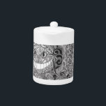 Cheshire Cat Design Teapot<br><div class="desc">An Alice in Wonderland Character fashioned in design. Original art, hand drawn with pen and ink medium. This brings about warmth and whimsy along with unique characteristics in each design. Inconsistencies are true to the work crafted in Freehand Style.</div>