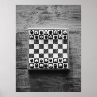 Chess Board Game on Rustic Wooden Table Poster