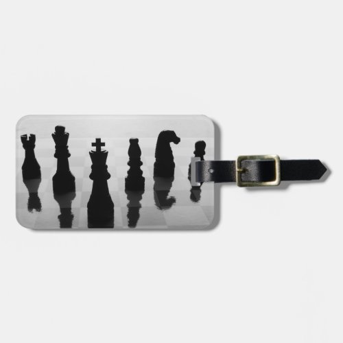 Chess pieces on chess board in black and white luggage tag