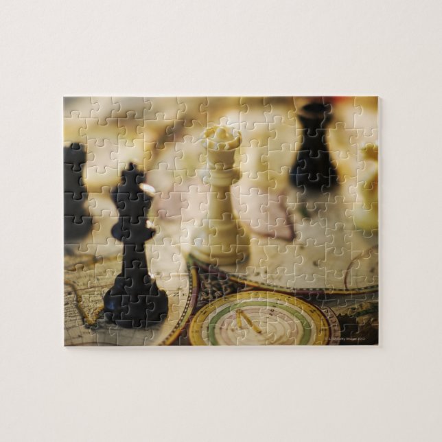 Chess pieces on old world map jigsaw puzzle (Horizontal)