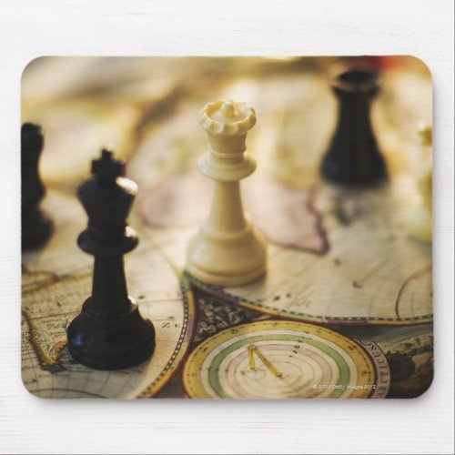 Chess pieces on old world map mouse pad
