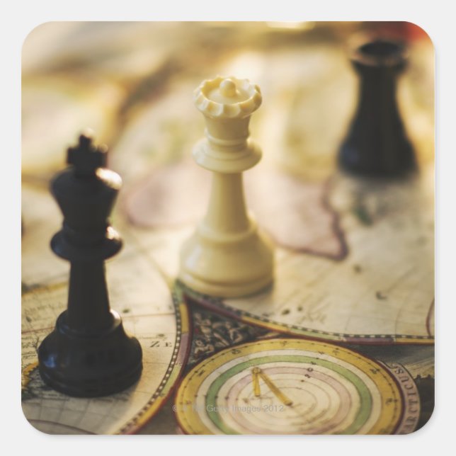 Chess pieces on old world map square sticker (Front)