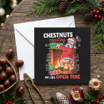 Chestnuts Roasting Funny Santa Christmas Quote Holiday Card<br><div class="desc">This humorous Christmas design features the phrase “Chestnuts roasting on an open fire” with a playful Santa illustration in front of a fireplace on a black background. The bold typography and warm festive colors make the joke easy to notice while giving the artwork a cheeky holiday feel. It blends classic...</div>
