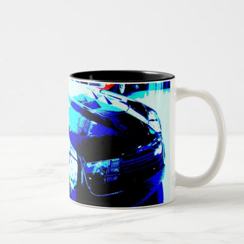 Chevy Camaro ZL1 in showroom with a 1970 Corvette  Two-Tone Coffee Mug