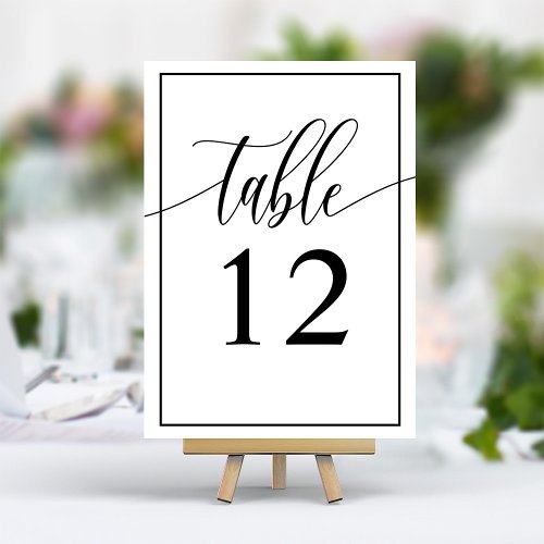 Chic Black And White Calligraphy Script Wedding Table Number