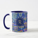 Chic Blue Gold Menorah Star of David Hanukkah Mug<br><div class="desc">This custom holiday coffee mug features a chic pattern of gold,  green and purple menorah and gold Star of David on a blue background. On either side is a blue circle boarded in gold for your monogram initial to personalize. Drink in style! Designed by world renowned artist Tim Coffey.</div>