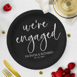 Chic Calligraphy We're Engaged Engagement Party Paper Plates<br><div class="desc">A stylish calligraphy engagement party paper plate. Easy to personalize with your details. CUSTOMIZATION: If you need design customization,  please contact me through chat; if you need information about your order,  shipping options,  etc.,  please get in touch with Zazzle support directly.</div>