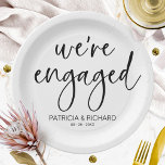 Chic Calligraphy We're Engaged Engagement Party Paper Plates<br><div class="desc">A stylish calligraphy engagement party paper plate. Easy to personalize with your details. CUSTOMIZATION: If you need design customization,  please contact me through chat; if you need information about your order,  shipping options,  etc.,  please get in touch with Zazzle support directly.</div>