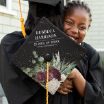Chic Girly Burgundy Florals, Greenery Graduate Graduation Cap Topper<br><div class="desc">Stand out from this crowd with this gorgeous graduation cap topper, featuring a striking black background, burgundy and white florals, watercolor greenery, faux gold confetti, plus your name, class year, and school details. Personalize your commencement style and let your accomplishment shine with every detail. Show off your achievement and commemorate...</div>