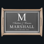 Chic Grey Newlywed Couple Monogram Name Wedding Serving Tray<br><div class="desc">Modern minimalist personalized dark grey and white serving tray with the couples first names in a calligraphy script,  last name monogram,  full last name,  and wedding date available in customizable templates.  A stylish,  elegant newlywed gift for the bride and groom with a custom personal touch.</div>