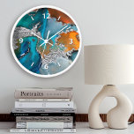 Chic marble watercolor silver turquoise orange clock<br><div class="desc">White graphic numerals overlay a rich, glam, silver veined, turquoise blue and yellow orange abstract watercolor on this elegant, trendy, modern, wall clock. Your choice of a round or square clock face. Makes a welcome and stylish statement wherever it’s hung. A great addition to your living room or bedroom, as...</div>
