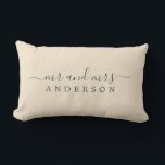Chic Newlywed Mr Mrs Ivory Monogram Lumbar Pillow<br><div class="desc">Chic, modern monogrammed ivory pillow with the text Mr and Mrs in off-black elegant script on an ivory background. The color magnolia blossom is used for this stylish design. Simply add your married name. Perfect luxury wedding gift for the newlywed couple. Exclusively designed for you by Happy Dolphin Studio. If...</div>
