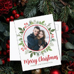 Chic Red Holly Berry Christmas Wreath Couple Photo Holiday Postcard<br><div class="desc">This gorgeous red holly berry Christmas wreath encircles your holiday photo inside of a circle. A chic holiday postcard for a modern couple or family. Botanical green leaves spring out of the beautiful photograph.</div>