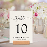 Chic Script Cream Wedding Reception Table Number Holder<br><div class="desc">Chic light cream wedding reception 5X7 table numbers with giclee photo cards and wood holders. These signs feature "table" in a stylish calligraphy script with swashes, the table number in elegant serif typography, your first names joined by a heart and your reception date. Create each table number sign and add...</div>