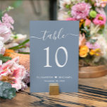 Chic Script Dusty Blue Wedding Reception Table Number<br><div class="desc">Chic dusty blue wedding reception table number sign featuring "table" in a stylish white calligraphy script with swashes, the table number in elegant white serif typography, your first names joined by a heart and your reception date. Create each table number sign and add to your shopping cart one at a...</div>