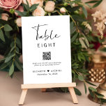 Chic Script QR Code Wedding Reception Table Number<br><div class="desc">Chic wedding reception table number sign featuring "Table" in a stylish modern script,  the table number in simple modern typography,  your names joined together by a heart,  your reception date,  and a QR code linked to your website for guests to scan to upload photos or for other reasons.</div>