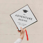Chic Tassel The Adventure Begins Graduation Cap Topper<br><div class="desc">This chic tassel the adventure begins graduation cap topper is perfect for a modern graduation. The simple design features classic minimalist black and white typography with a black and gold watercolor graduation hat.

Personalize your graduation cap with the name of the graduate and the year.</div>