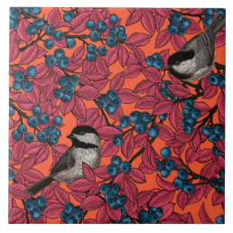 Chickadee birds on blueberry branches on orange ceramic tile