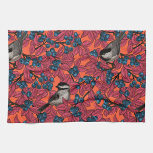 Chickadee birds on blueberry branches on orange kitchen towel