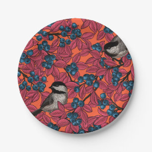 Chickadee birds on blueberry branches on orange paper plates