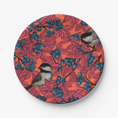Chickadee birds on blueberry branches on orange paper plates