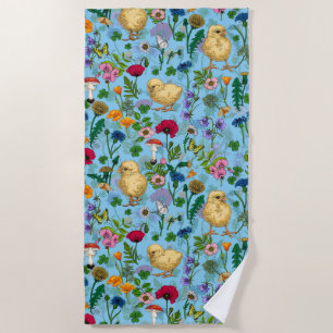 Chickens and wildflowers on baby blue beach towel