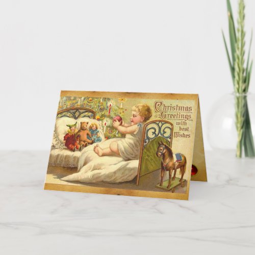 CHILD ON THE BED WITH TOYS AND CHRISTMAS GIFTS HOLIDAY CARD