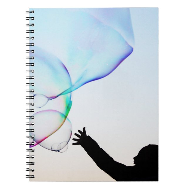 child plays with minimal bubbles notebook (Front)
