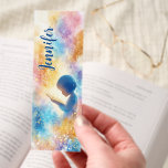 Child Reading Bible Spiritual Personalized Bookmarks<br><div class="desc">Inspire a love for faith with this touching personalized Christian bookmark. It features a serene image of a child engrossed in reading the Bible, surrounded by a gentle aura of spiritual light and colorful accents. This design beautifully symbolizes the importance of scripture and early devotion. Perfect as a thoughtful gift...</div>