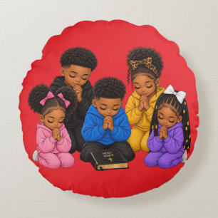 Children praying round pillow