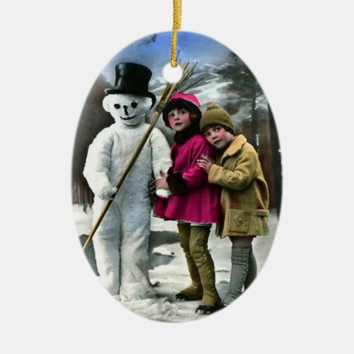 CHILDREN WITH SNOWMAN CERAMIC ORNAMENT