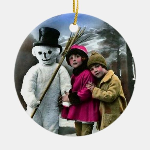 CHILDREN WITH SNOWMAN CERAMIC ORNAMENT