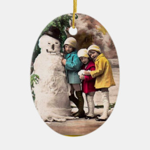 CHILDREN WITH SNOWMAN CERAMIC ORNAMENT