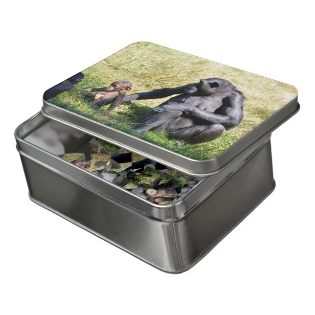 Chimpanzees with her baby sitting on grass  jigsaw puzzle (Lid Open)