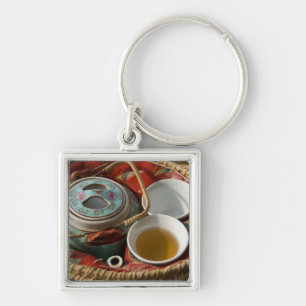 China, Hong Kong. Traditional Chinese teapot & 3 Keychain
