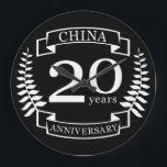 China Traditional wedding anniversary 20 years Large Clock<br><div class="desc">A design to celebrate 20 years of marriage. This design has a white (china) colored laurel design on a black background. China is the traditional gift for this occasion. The text reads china 20 years anniversary. A romantic design to celebrate your 20th year of marriage. If you would like any...</div>