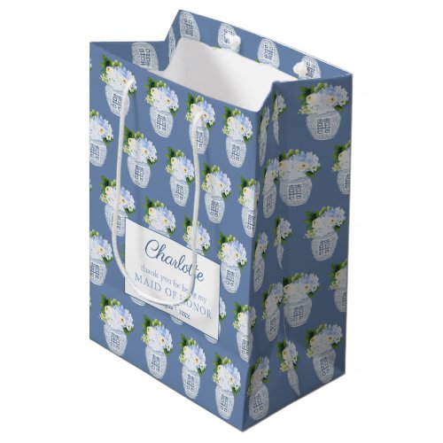 Chinoiserie Blue And White Maid Of Honor Thank You Medium Gift Bag - The background of this gift bag design is a watercolor ginger jar vase which is filled with blue and white flowers / green leaves, arranged into a repeating pattern. The text shown is for a Maid Of Honor thank you bag but all of the text fields are customizable to your needs. 