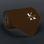 Chocolate Brown Elegant Monogram   Name One-Sided Neck Tie<br><div class="desc">An elegant one-sided necktie featuring a bold white monogram across a rich Chocolate background. On top of this monogram sits your first or last name spelled out in all capitals. If you prefer a bolder look for the personal name inside of the large letter you can do the following: Use...</div>