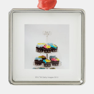 Chocolate cupcakes on a cake stand metal ornament