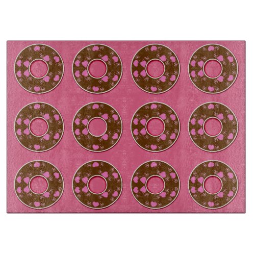 Chocolate donuts doughnuts on pink cutting board