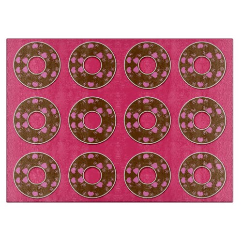 Chocolate donuts on hot pink cutting board